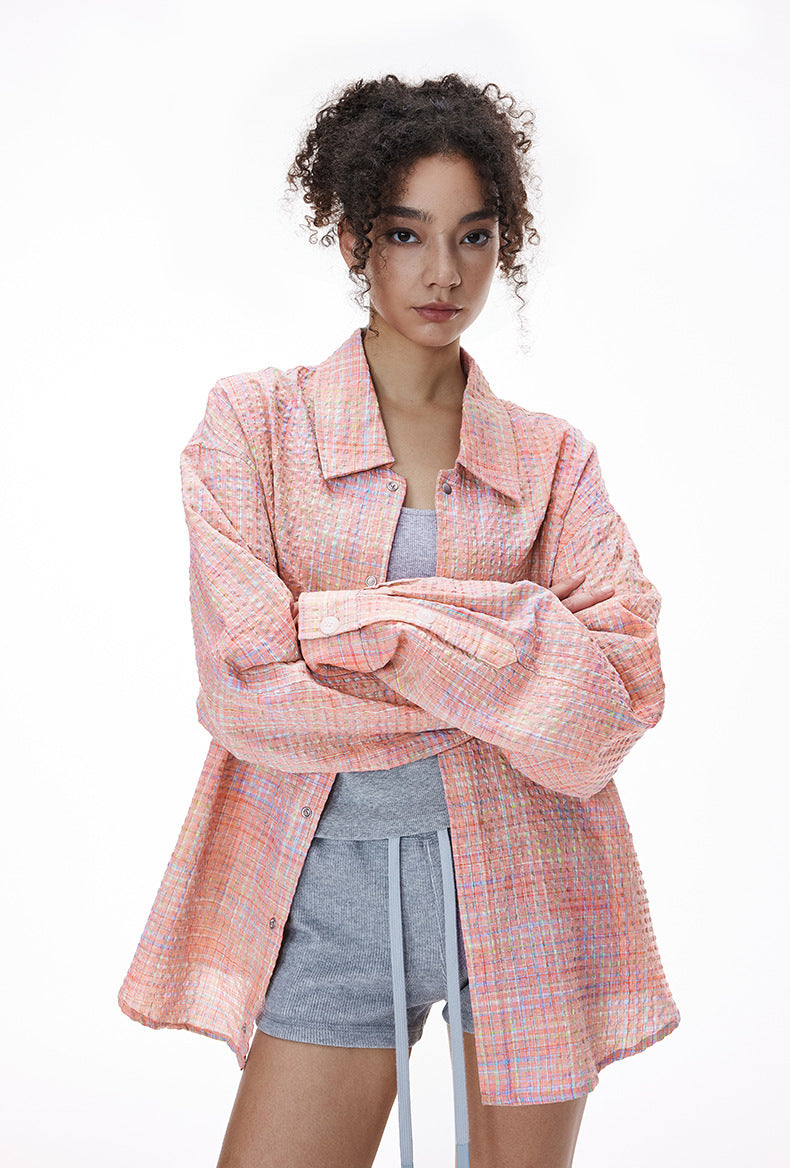 Pink plaid shirt open over mini dress, casual layer