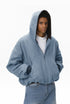 Blue plush zip jacket with hood up, front view.