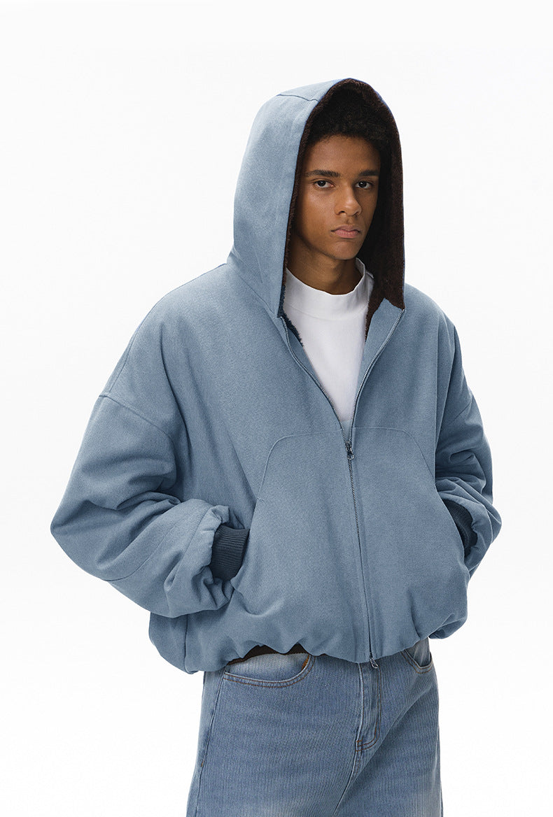 Blue plush zip jacket with hood up, front view.