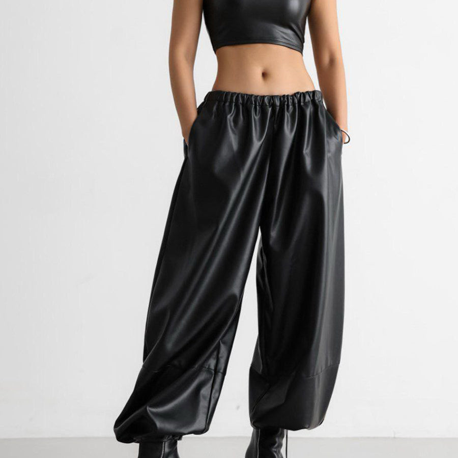 PU leather women’s pants styled with crop top and heels