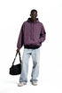 Purple oversized hoodie front view on model, roomy street fit