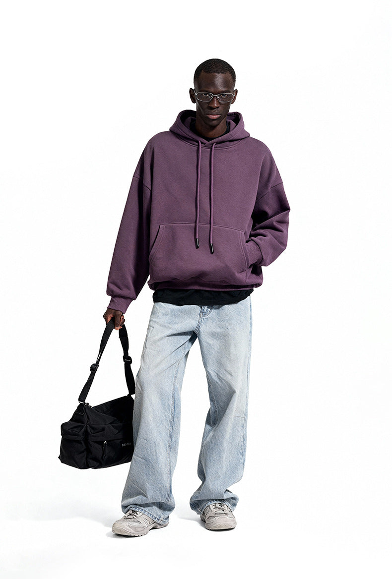 Purple oversized hoodie front view on model, roomy street fit