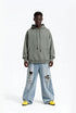Sage oversized hoodie front view on model, casual street style
