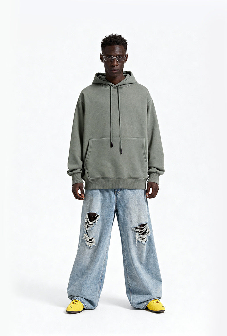 Sage oversized hoodie front view on model, casual street style