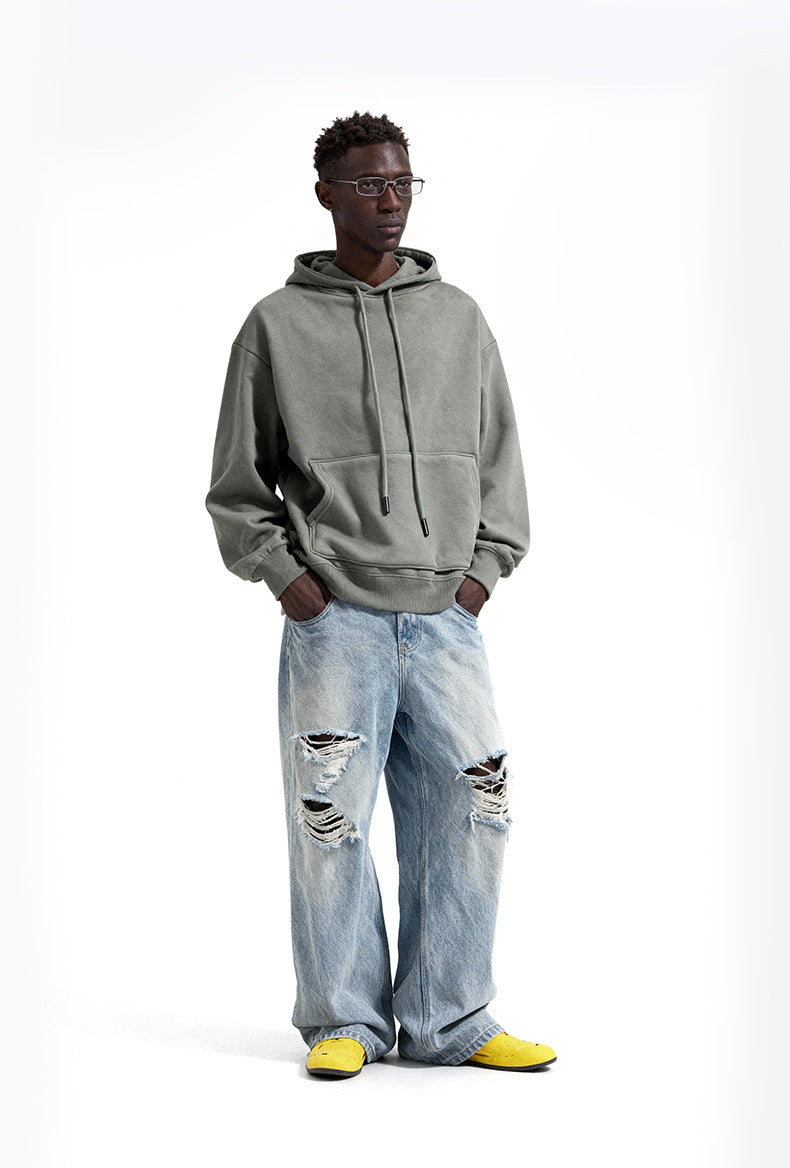 Sage oversized hoodie side view on model, drop shoulder fit