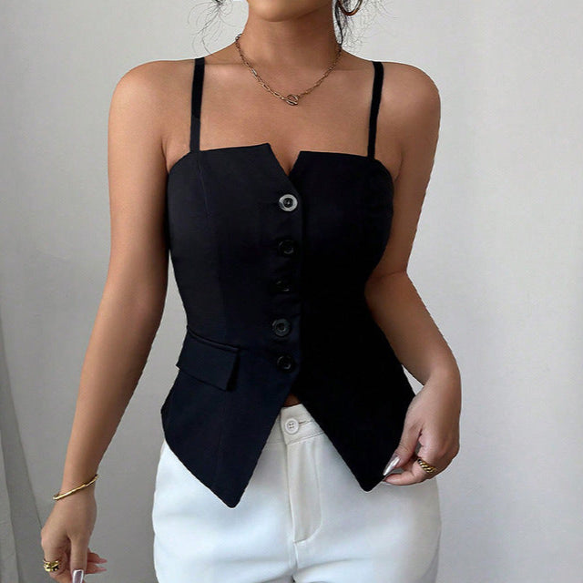 Woman wearing sexy black corset top with buttons and straps, styled with white pants in minimal studio setting
