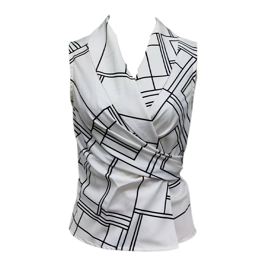 Flat lay of white sleeveless top with black geometric pattern on a white background
