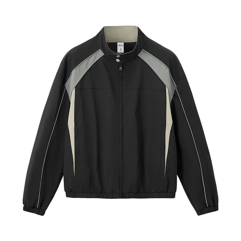 Black racing jacket flat lay front, contrast arcs and zip pockets
