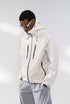 Off-white windbreaker jacket left side view, clean paneled finish