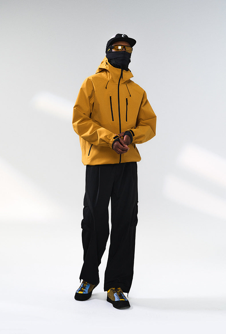 Yellow windbreaker jacket three-quarter front, full body street pose