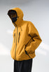 Yellow windbreaker jacket profile close-up, chin guard and hood