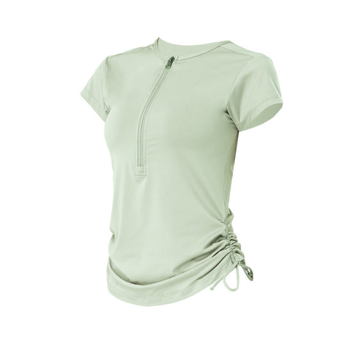 Mint athletic tee with front zipper and gathered side hem.