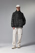 Black women’s puffer jacket front on model, relaxed street fit