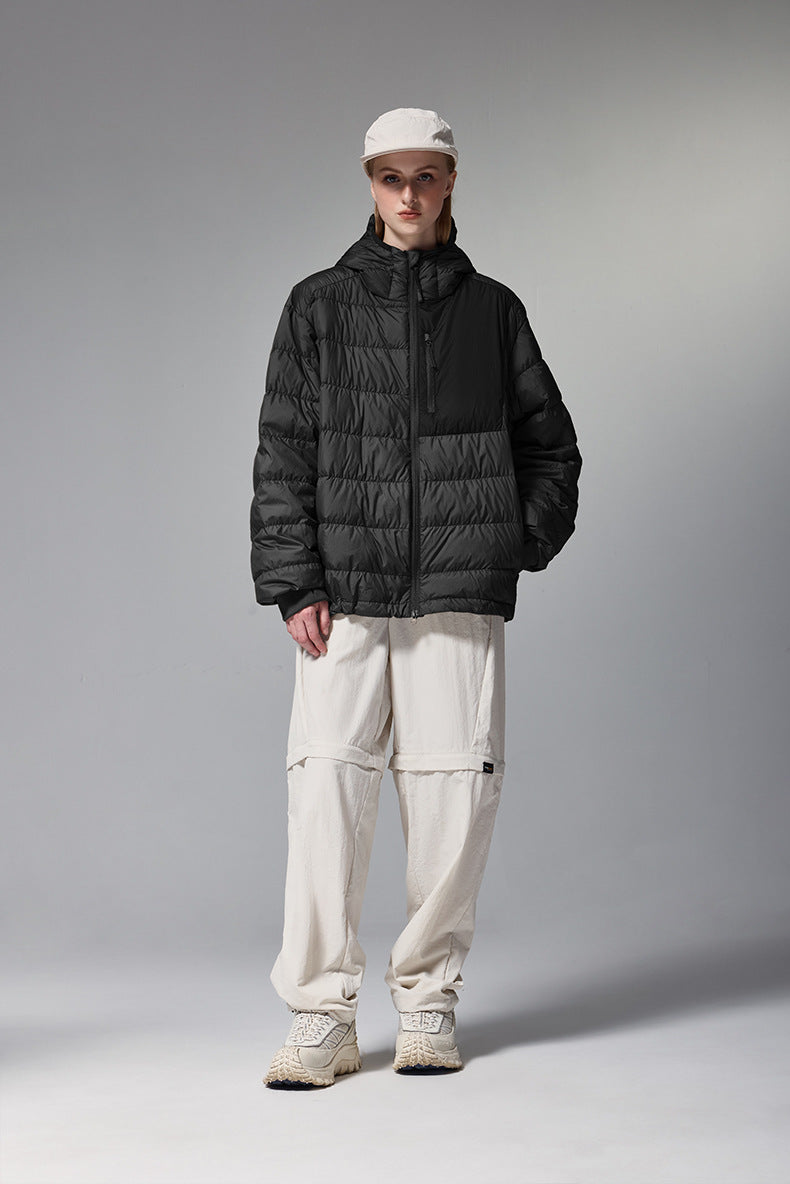 Black women’s puffer jacket front on model, relaxed street fit