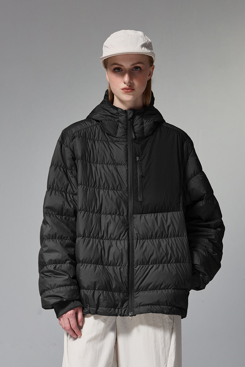 Black women’s puffer jacket side profile, medium length