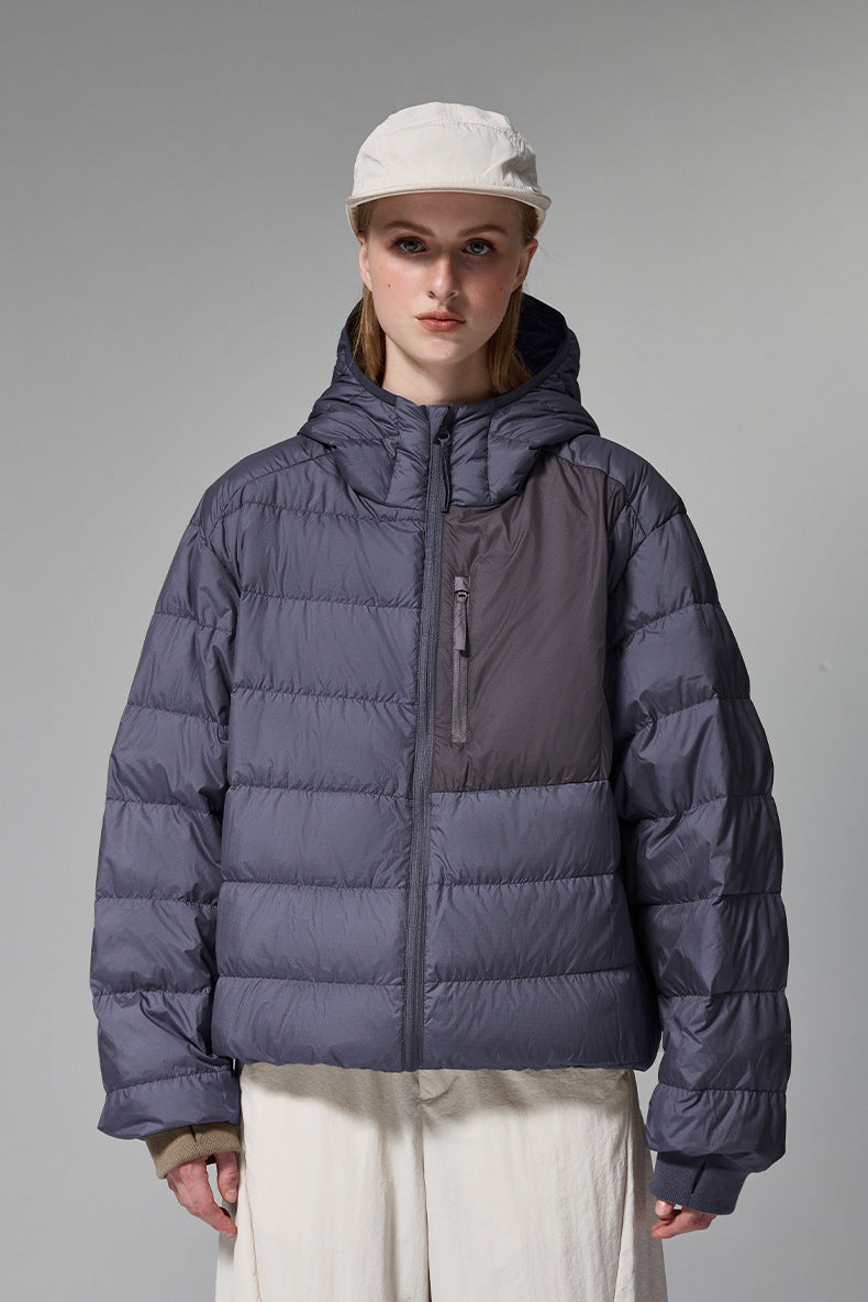 Navy blue women’s puffer jacket front close view, street fit