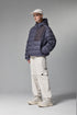 Navy blue women’s puffer jacket front on model, hooded down coat