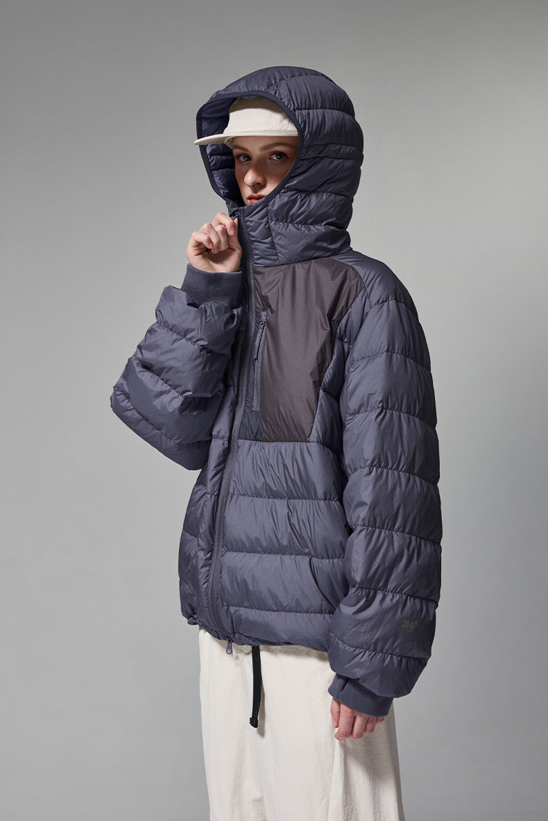 Navy blue men’s puffer jacket side profile with jacket all zipped up.
