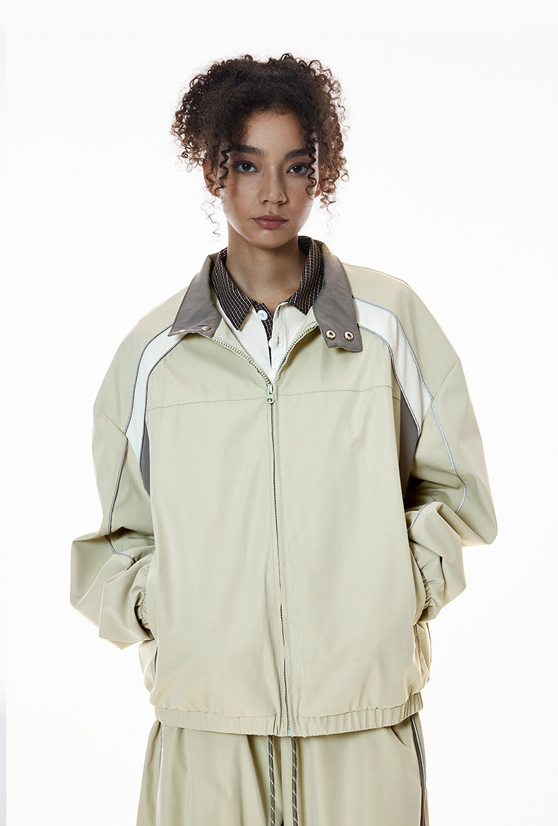 Light gray racing jacket zipped, relaxed stance, women’s wide leg pants