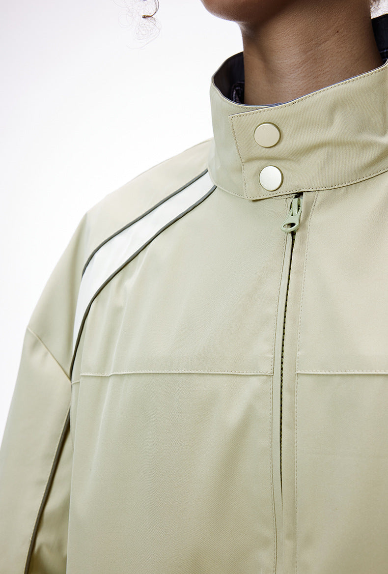 Light gray racing jacket collar snap and zipper guard close-up