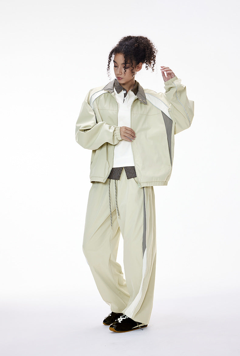 Light gray women’s tracksuit front view, racing jacket with women’s wide leg pants
