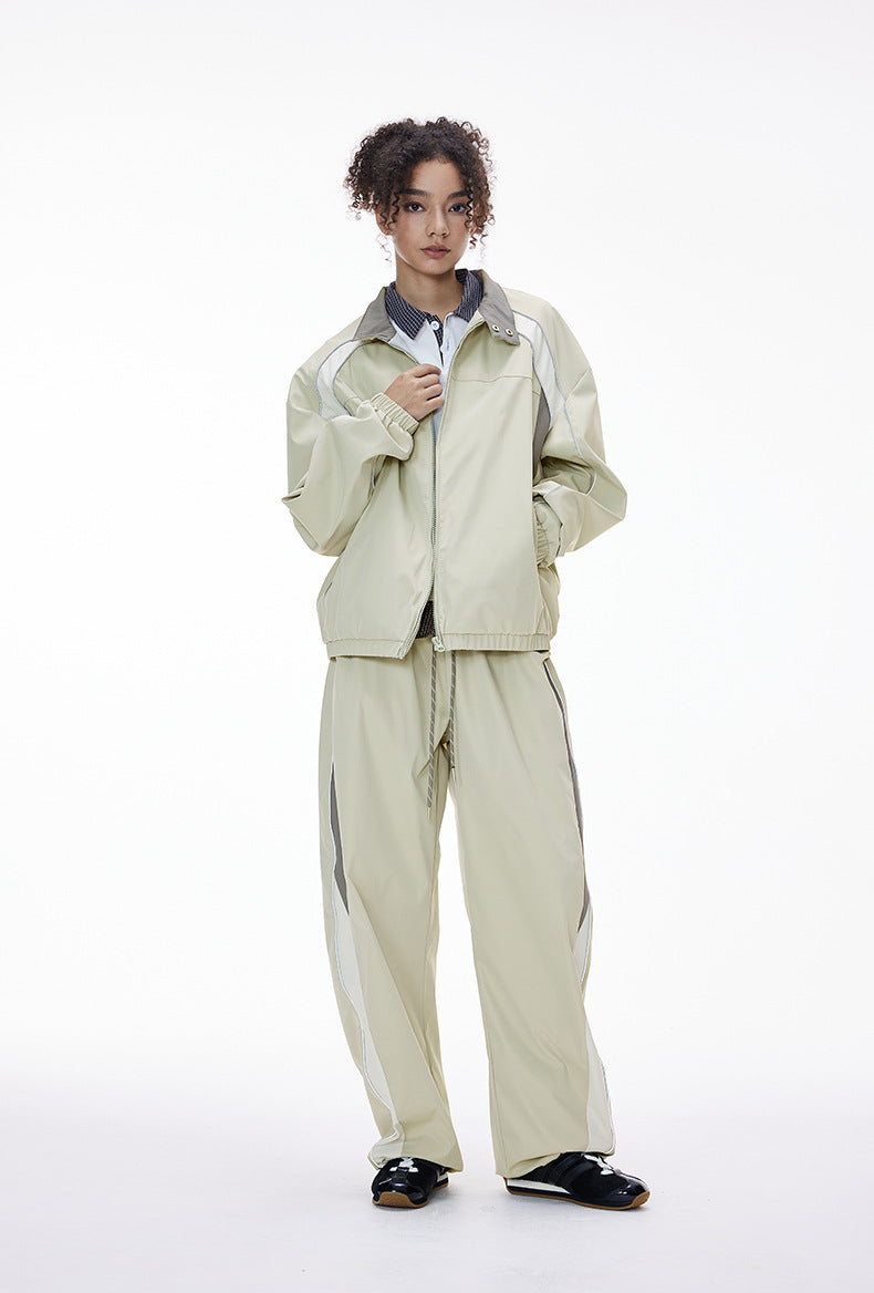 Light gray tracksuit full body, jacket open, wide leg pants flow