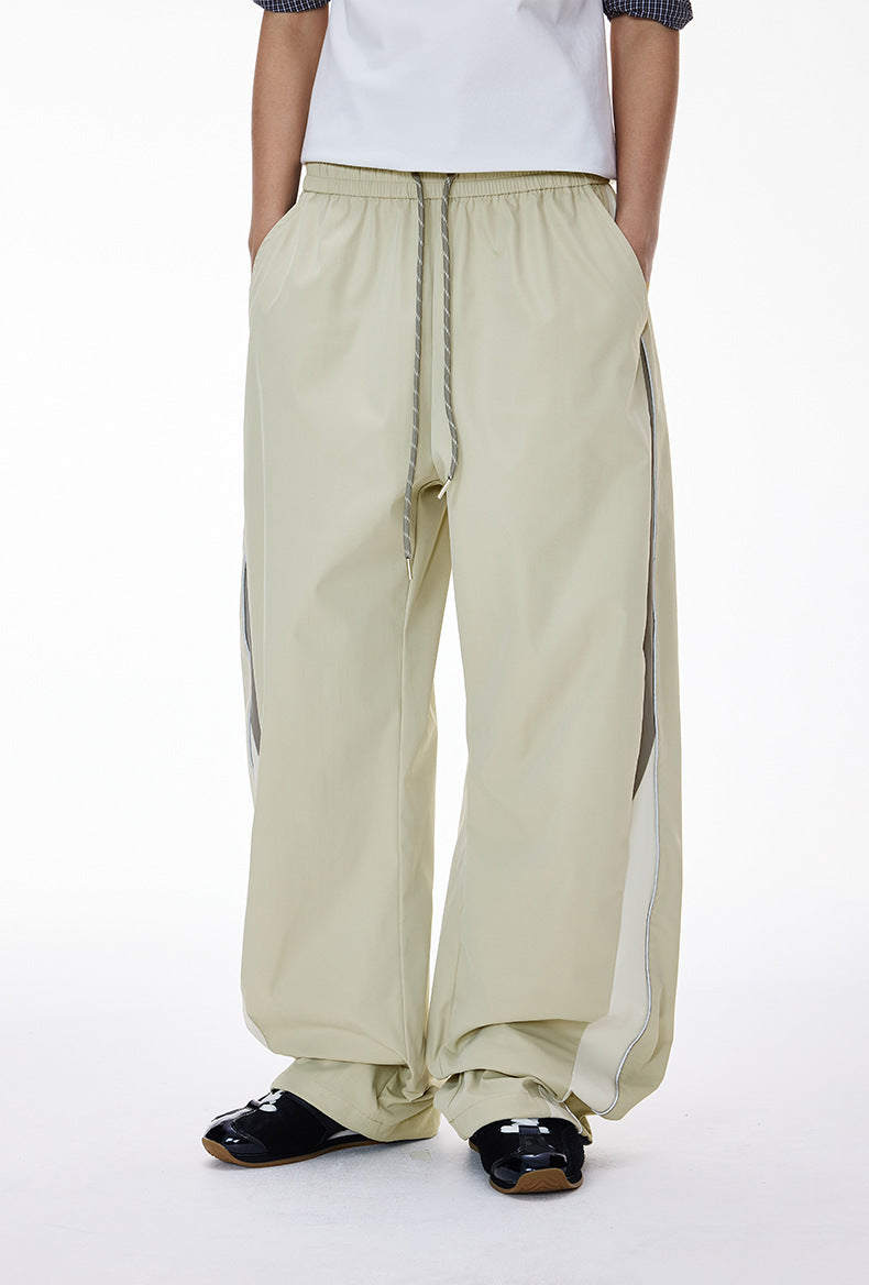 Light gray women’s wide leg pants front view, relaxed tracksuit drape