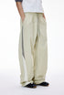 Light gray women’s wide leg pants side view with hand in pocket