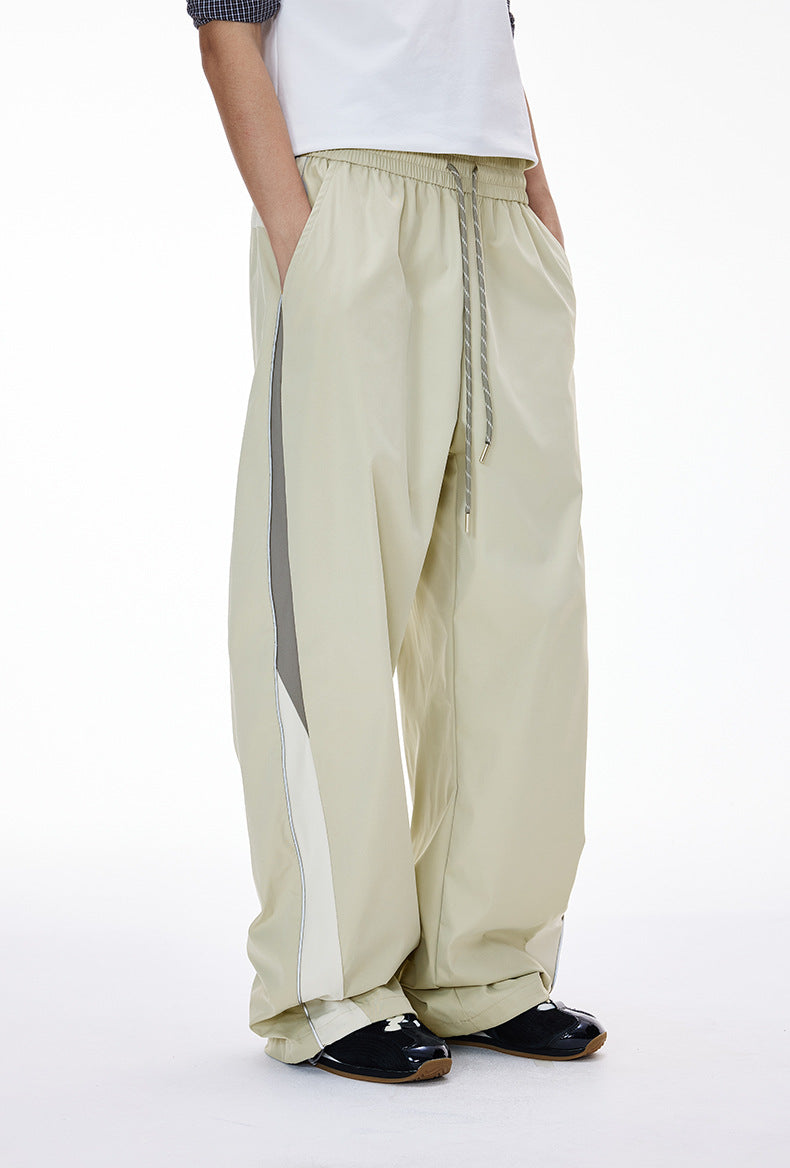 Light gray women’s wide leg pants side view with hand in pocket
