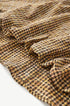 Yellow plaid shirt gathered fabric close-up, soft seersucker