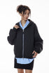 Navy blue zip hoodie on female model half-zip layered over shirt