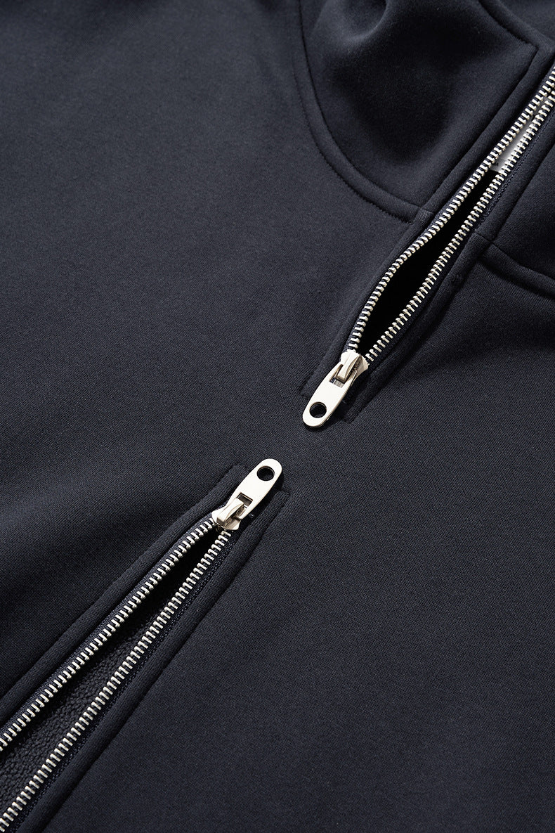 Navy hoodie close-up showing parallel double zipper teeth