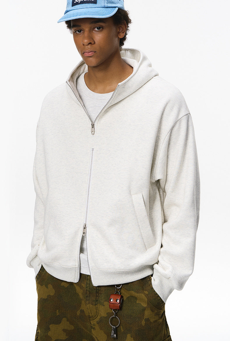 Quill gray zip hoodie on male model, hands in pockets