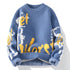 A blue crewneck sweater with white and yellow abstract pattern detail, featuring ribbed edges and relaxed fit against white backdrop