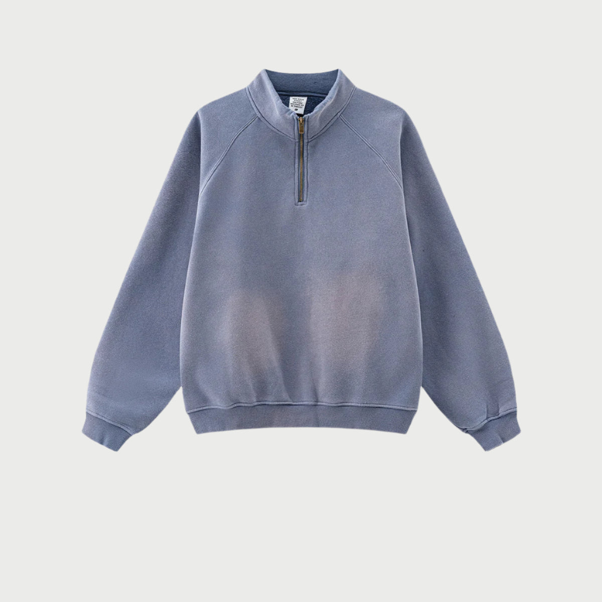 Black quarter-zip pullover with faded center wash, mock collar, brass zipper, raglan sleeves, heavyweight cotton blend
