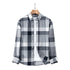 Gray and white plaid button-down shirt on wooden hanger. Crisp pattern with contrasting navy squares
