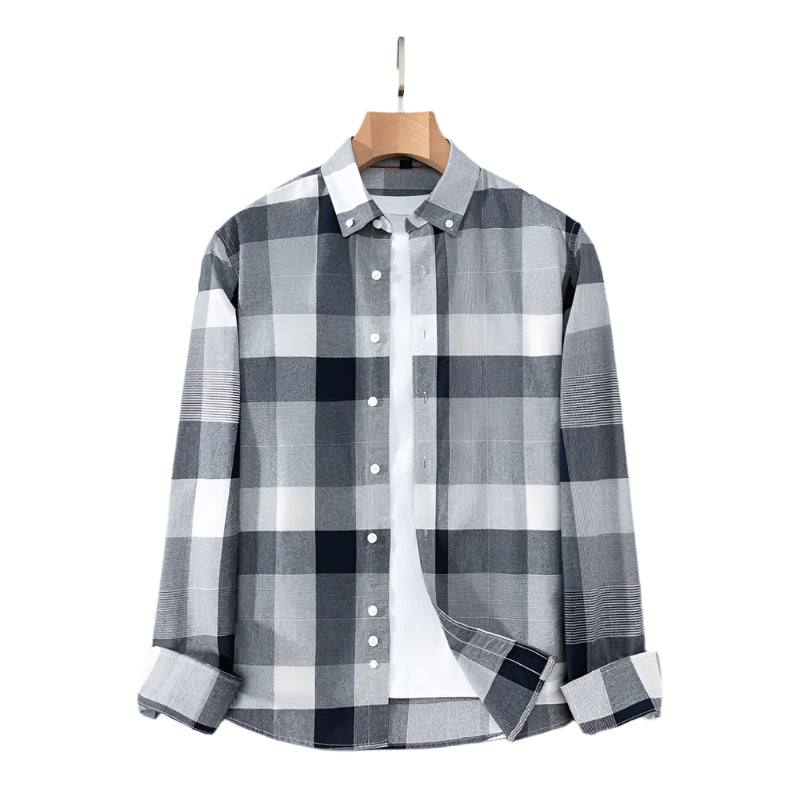 Gray and white plaid button-down shirt on wooden hanger. Crisp pattern with contrasting navy squares