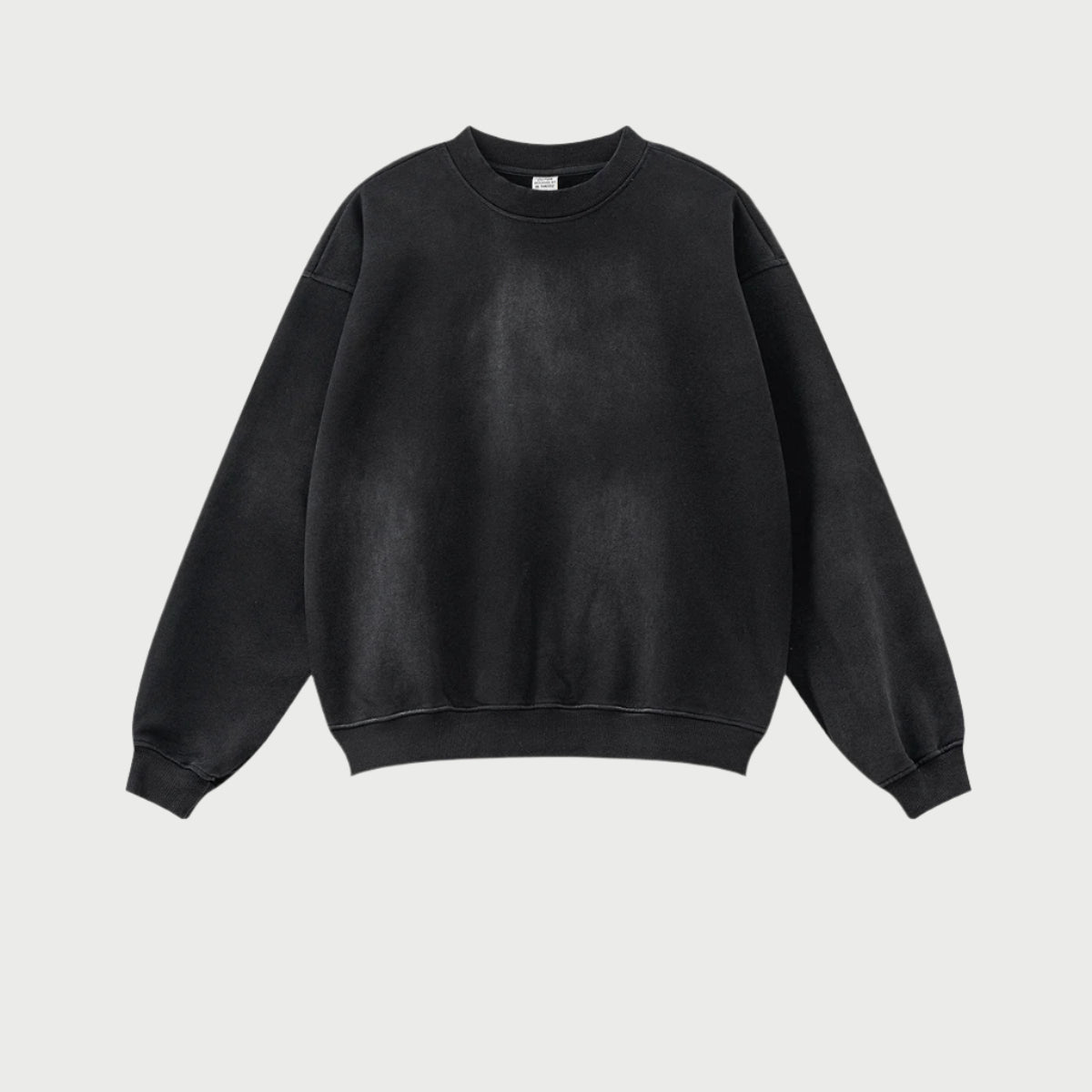 Black oversized sweatshirt with ribbed trim detail, showcasing soft brushed cotton texture