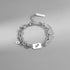 Sagittarius zodiac bracelet with a silver charm and a trendy layered chain, displayed on a minimalist background.