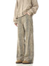 A model wearing beige zip-up hoodie and leopard print wide-leg pants with hands in pockets, standing against white background