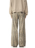 Rear view of leopard print wide-leg pants paired with beige sweatshirt, showing back pocket detail against white background