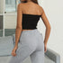 Black tube top with embroidered sunflowers paired with grey sweatpants