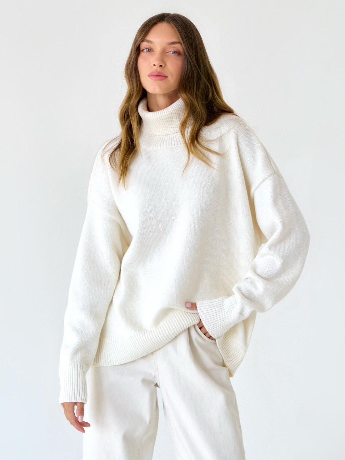Cozy white oversized turtleneck sweater on hanger, soft ribbed texture, minimalist studio background