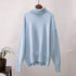 Soft pastel blue turtleneck on hanger, relaxed fit with ribbed details, minimalist style