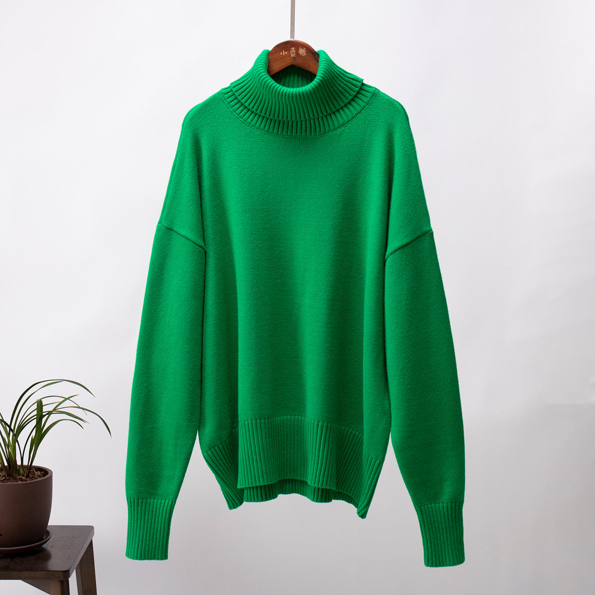 Bright kelly green turtleneck on hanger, thick ribbed collar, winter knitwear