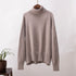 Light gray turtleneck sweater with relaxed fit, ribbed details, classic neutral style