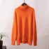 Burnt orange turtleneck sweater, wooden hanger, cozy knit texture, studio setting