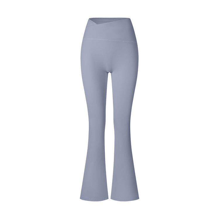 Powder blue high-waisted flared yoga pants photographed flat against white background, featuring seamless construction