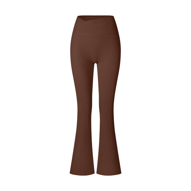 Brown high-waisted flared yoga pants photographed flat against white background, featuring bootcut design and compression fit