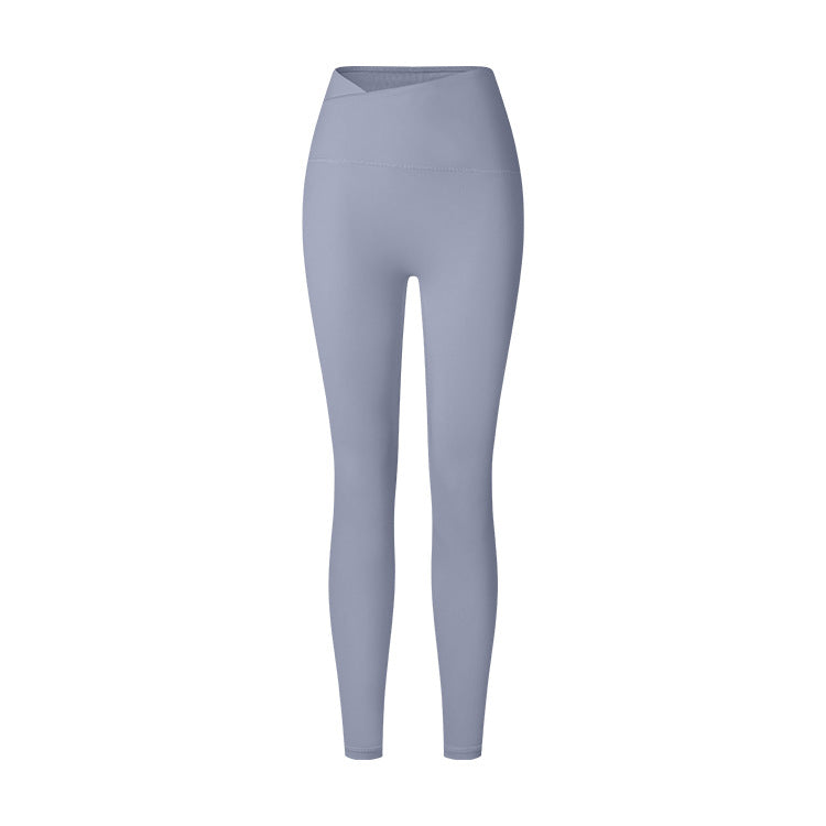 A product image displaying steel blue high-waisted compression leggings with V-shaped waistband and seamless design against white background